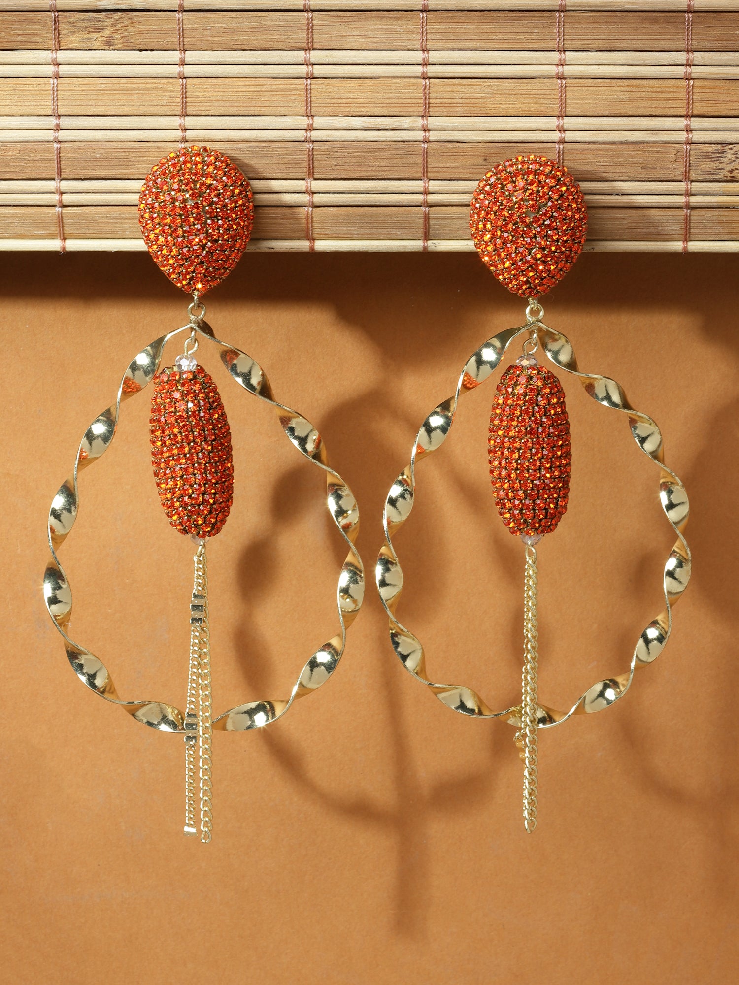 Twirled Orange Hoop Earrings